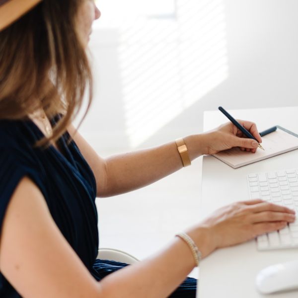 Girl in dark blue dress writing Girl in dark blue dress writing